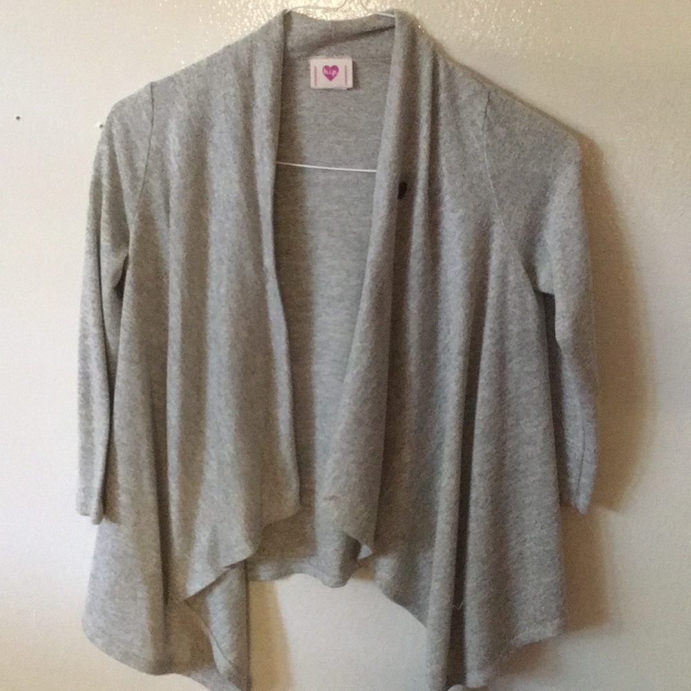 Grey sweater with a brown sewed on button